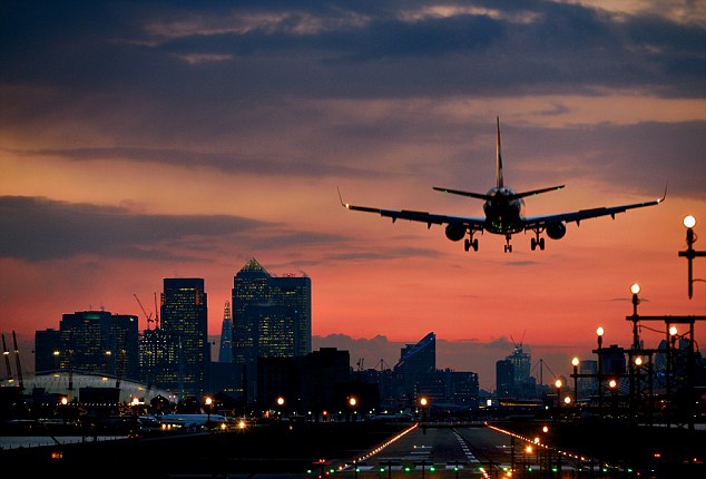 Landing airplane at dusk