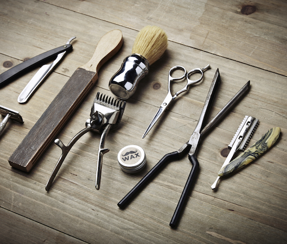 Vintage tools of barber shop on wood desk